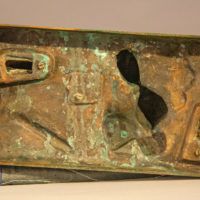 Alt text: Underside of a bronze sculpture of Theseus fighting a minotaur