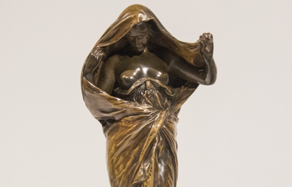 Alt text: Bronze sculpture of a woman draped in fabric revealing her face and chest