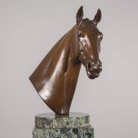 Alt text: Bronze bust of a Cherokee horse mounted on a marble base, frontal view
