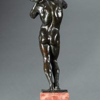 Alt text: Bronze sculpture of a nude figure holding a rock above his head