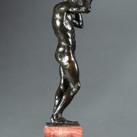 Alt text: Bronze sculpture of a nude figure holding a rock above his head