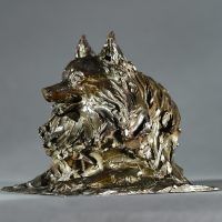 Alt text: Bronze sculpture of a pomeranian