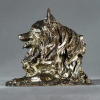 Alt text: Bronze sculpture of a pomeranian