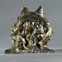 Alt text: Bronze sculpture of a pomeranian