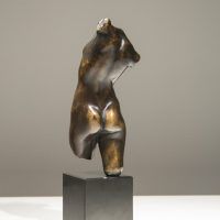 Alt text: Bronze sculpture of a twisting female torso