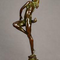 Alt text: Bronze sculpture of a nude woman skipping and holding a fish in one hand