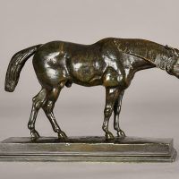 Alt text: Bronze sculpture of a half blood horse