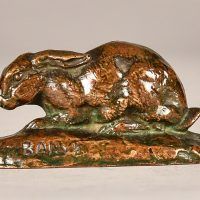 Alt text: Bronze sculpture of a rabbit with ears back