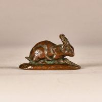 Alt text: Small bronze sculpture of rabbit with ears up