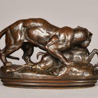 Alt text: Bronze sculpture of a tiger devouring an antelope