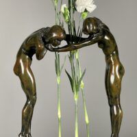 Alt text: Bronze sculpture of two figures holding hands