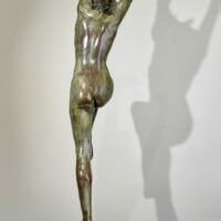 Alt text: Bronze sculpture of a standing woman