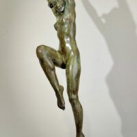 Alt text: Bronze sculpture of a standing woman