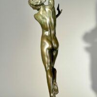 Alt text: Bronze sculpture of a standing woman