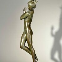 Alt text: Bronze sculpture of a standing woman