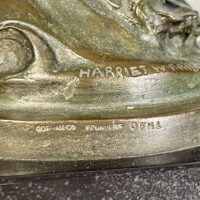 Alt text: Bronze sculpture, base detail