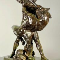 Alt text: Bronze sculpture of a man fighting a minotaur