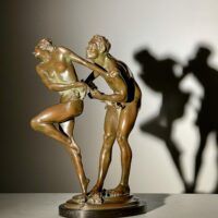 Alt text: bronze sculpture of two people