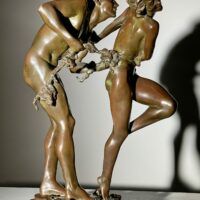 Alt text: bronze sculpture of two people