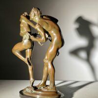 Alt text: bronze sculpture of two people