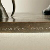 Alt text: Foundry Mark detail of Diana sculpture