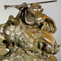 Alt text: Bronze sculpture of a Horseman Hunting Boars