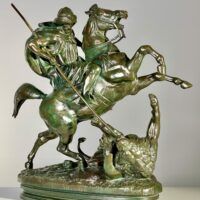 Alt text: Bronze sculpture of a horseman killing a lion