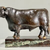 Alt text: Bronze sculpture of a bull