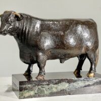 Alt text: Bronze sculpture of a bull