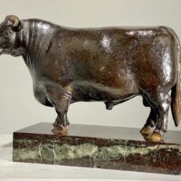 Alt text: Bronze sculpture of a bull