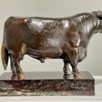 Alt text: Bronze sculpture of a bull