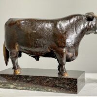 Alt text: Bronze sculpture of a bull