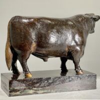 Alt text: Bronze sculpture of a bull