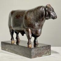 Alt text: Bronze sculpture of a bull