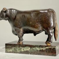 Alt text: Bronze sculpture of a bull