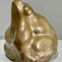 Alt text: Bronze sculpture of a frog