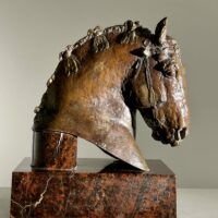 Alt text: Bronze sculpture of a horse's head