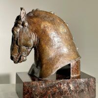 Alt text: Bronze sculpture of a horse's head