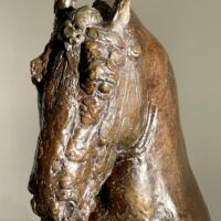 Alt text: Bronze sculpture of a horse's head