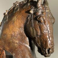 Alt text: Bronze sculpture of a horse's head