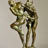 Alt text: Bronze sculpture of two figures holding a grape vine