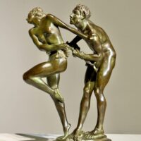 Alt text: Bronze sculpture of two figures holding a grape vine