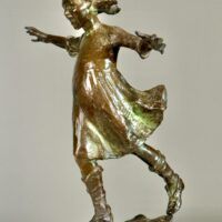 Alt text: Bronze sculpture of a girl roller skating on one foot