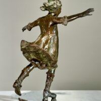 Alt text: Bronze sculpture of a girl roller skating on one foot
