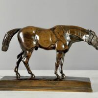 Alt text: bronze sculpture of a half blood horse