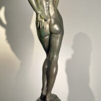 Alt text: Bronze sculpture of a nude woman