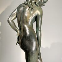 Alt text: Bronze sculpture of a nude woman