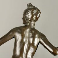 Alt text: Bronze sculpture of the Goddess Diana, detail