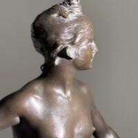Alt text: Bronze sculpture of the Goddess Diana, detail