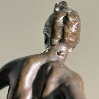 Alt text: Bronze sculpture of the Goddess Diana, detail